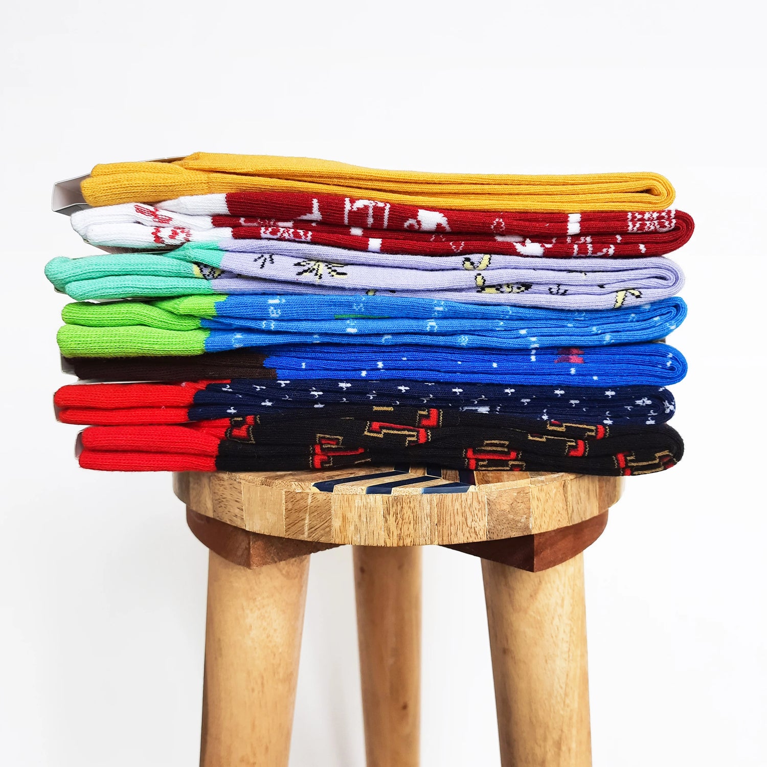 Stack of colorful folded custom socks 